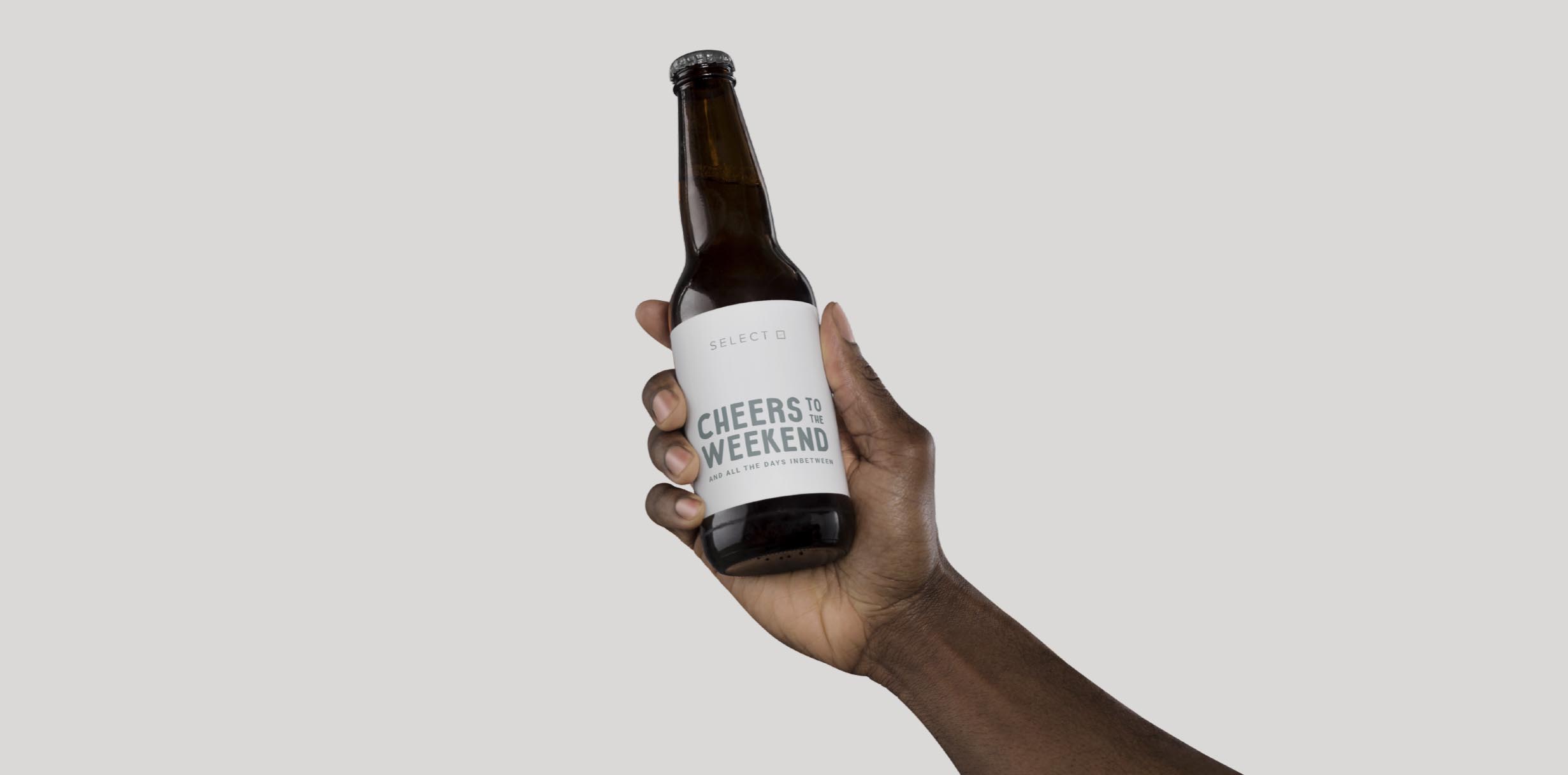 Cheers to the weekend text on beer bottle.