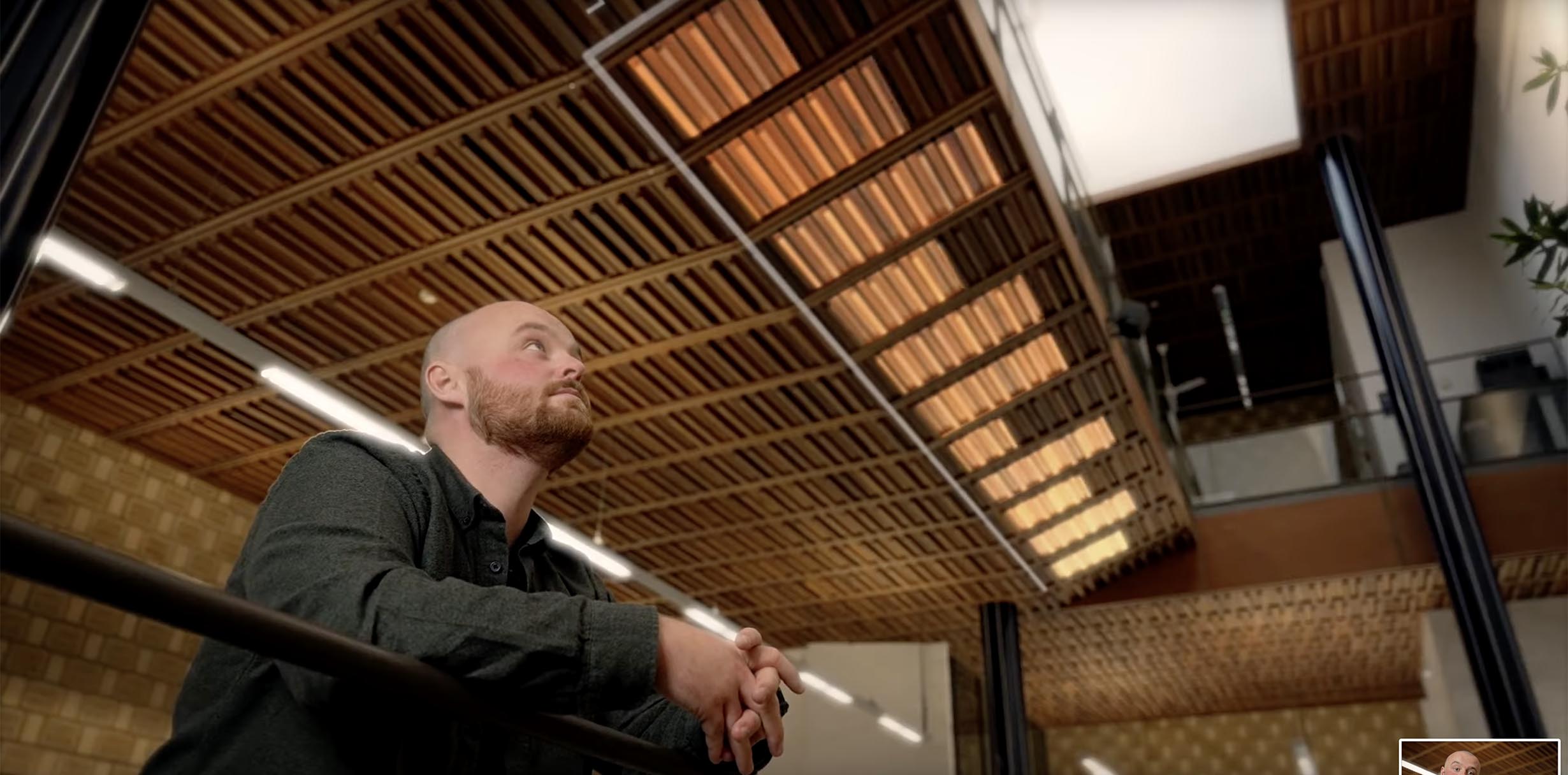 Data being shown on the ceiling with a man looking up